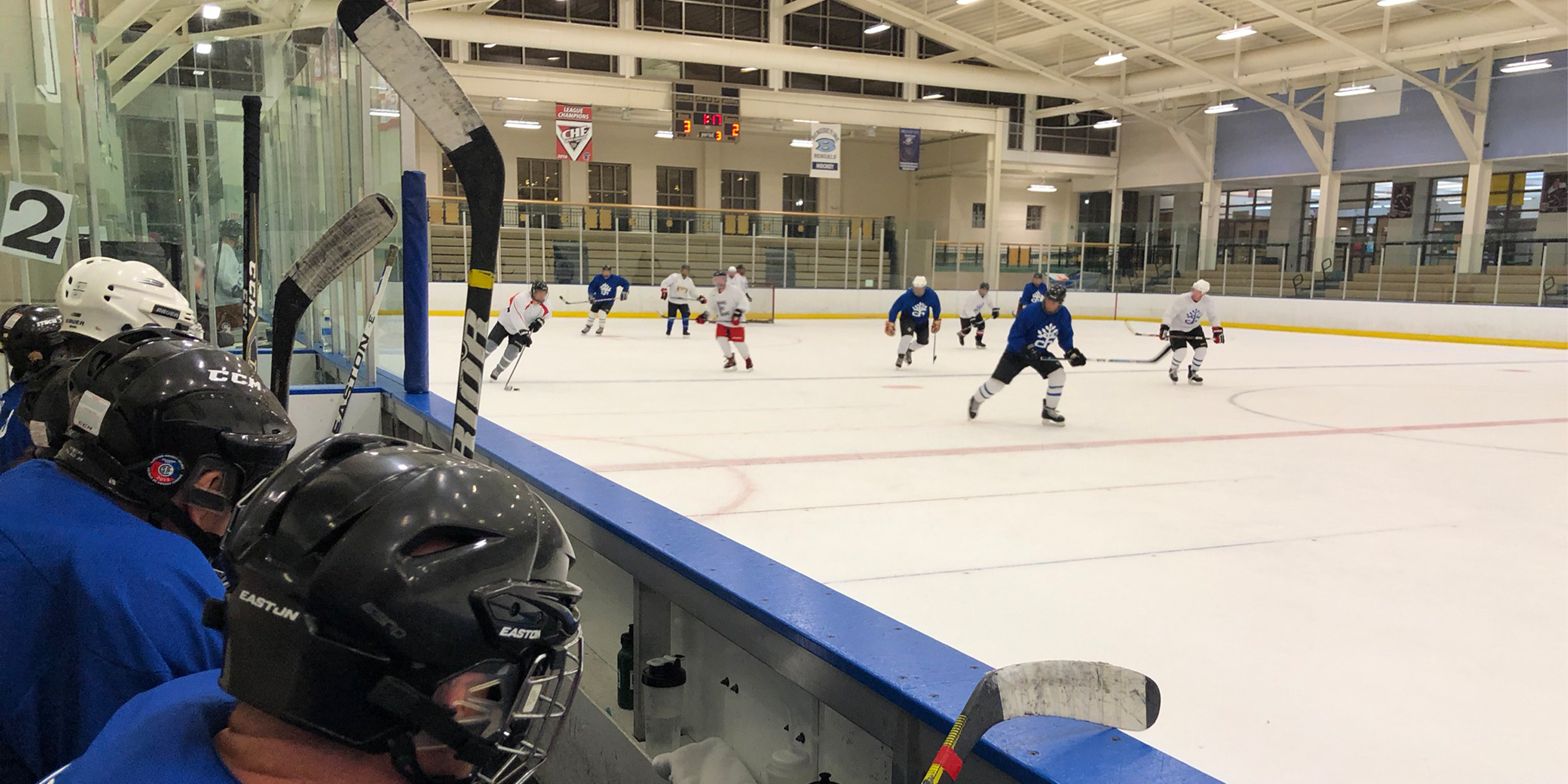 Players in action on ice. Image Credit to Mark Arehart of WKSU.