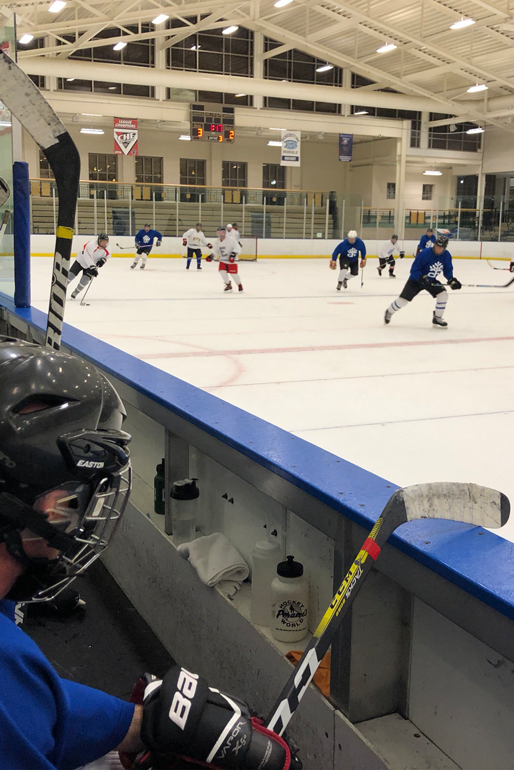 Players in action on ice. Image Credit to Mark Arehart of WKSU.